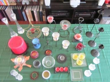 Collection of candle holders, many in use