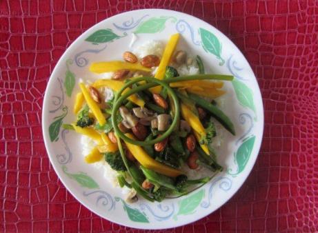 Stir fry with almonds, mangoes, mushrooms and scapes