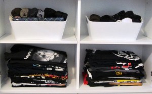 Rom's stuff: on top, 2 bins of socks. Below: two shelves of rock T-shirts