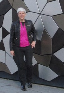 Black jeans and fuchsia hoodie