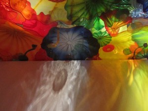 Overhead glass reflected onto walls