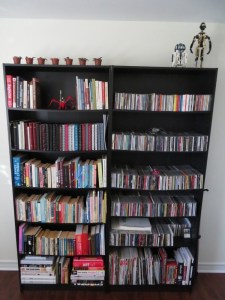 Bookshelves with books, CDs, C3PO and R2D2 models